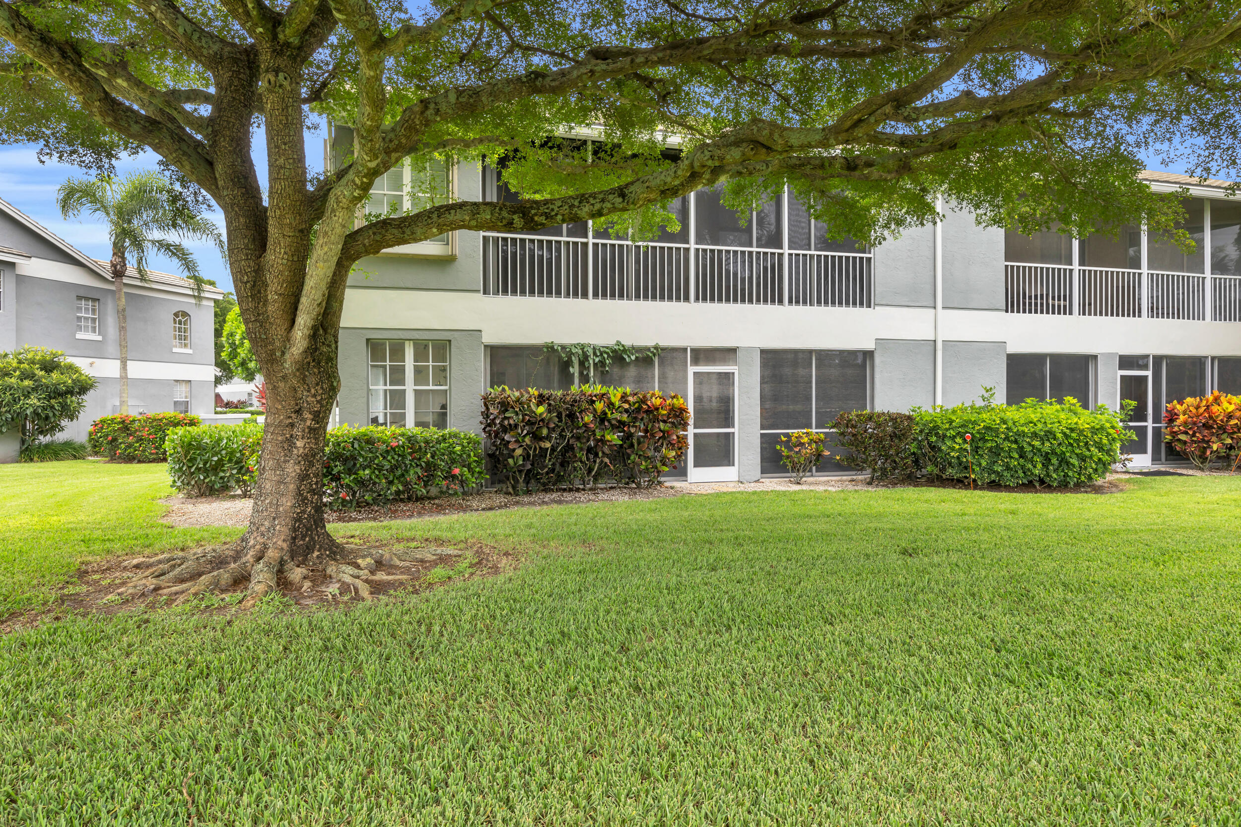 10172 Andover Coach Circle, Unit G2 Lake Worth, FL 33449 - Photo 35 of 64 a front view of a house with garden