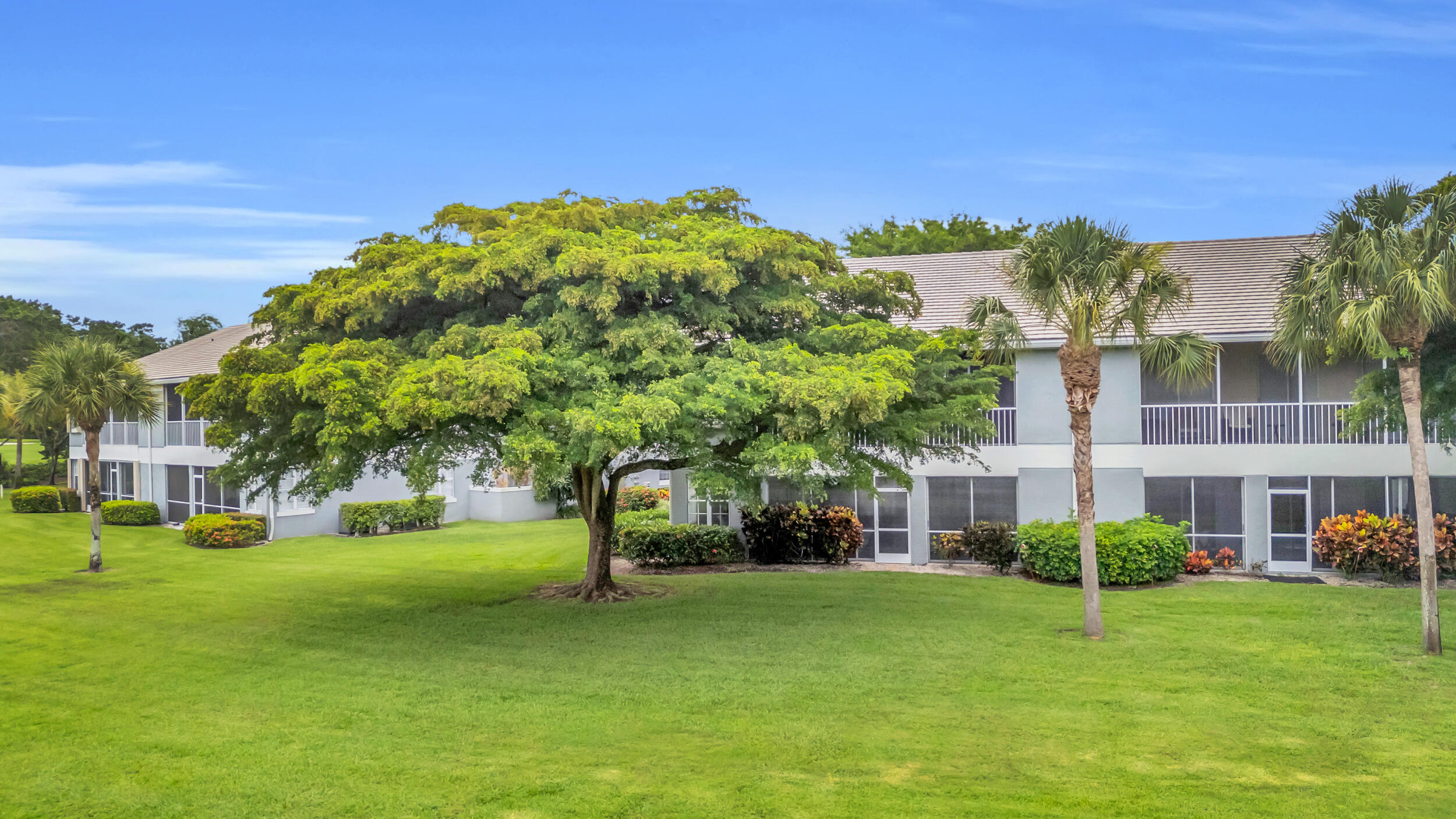 10172 Andover Coach Circle, Unit G2 Lake Worth, FL 33449 - Photo 36 of 64 a view of a house with a big yard