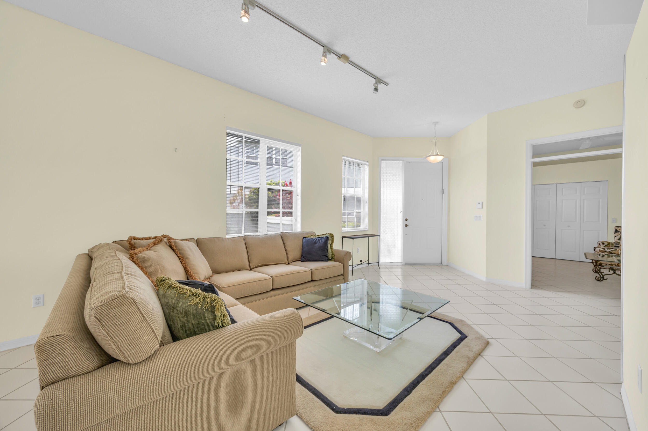 10172 Andover Coach Circle, Unit G2 Lake Worth, FL 33449 - Photo 10 of 64 a living room with furniture and a table