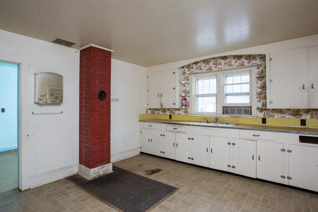 18525 Route 259 Mathias Wv 26812 Mathias, WV 26812 - Photo 19 of 36 a large white kitchen with a sink