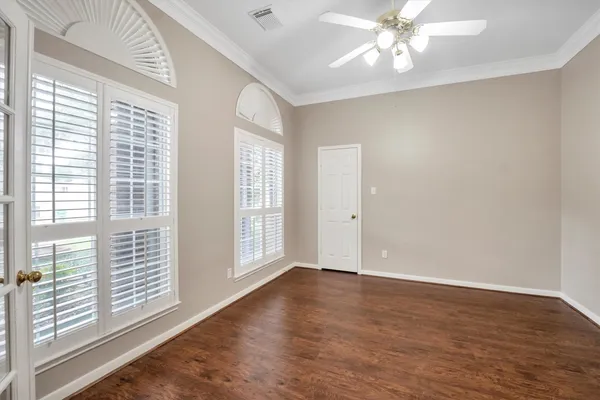 a spacious bathroom with a tub sink and mirror