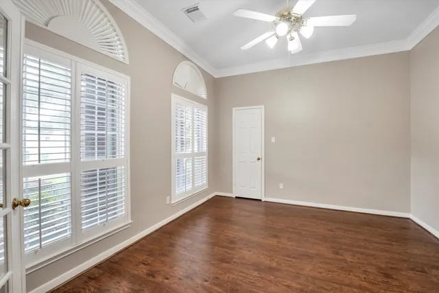 a spacious bathroom with a tub sink and mirror