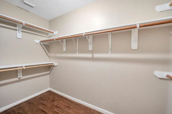 a white toilet sitting next to a shower