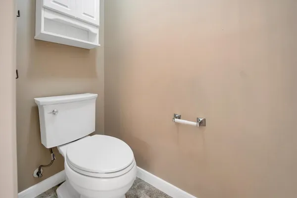 a spacious bathroom with a granite countertop sink mirror and a bathtub