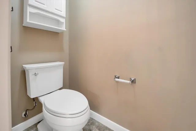 a spacious bathroom with a granite countertop sink mirror and a bathtub