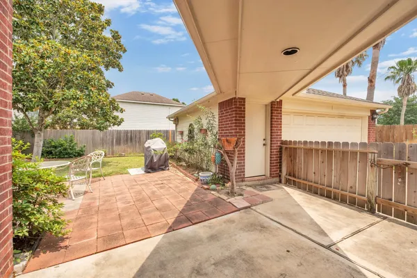 a swimming pool with outdoor seating and yard