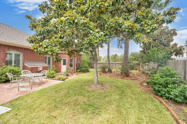 a view of a house with backyard porch and sitting area