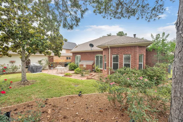 a view of a patio with a table chairs and a patio