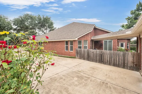 a front view of a house with a yard and a garage