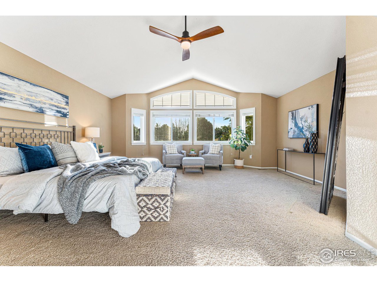 7452 Augusta Drive Boulder, CO 80301 - Photo 20 of 40 a living room with furniture a window and a flat screen tv