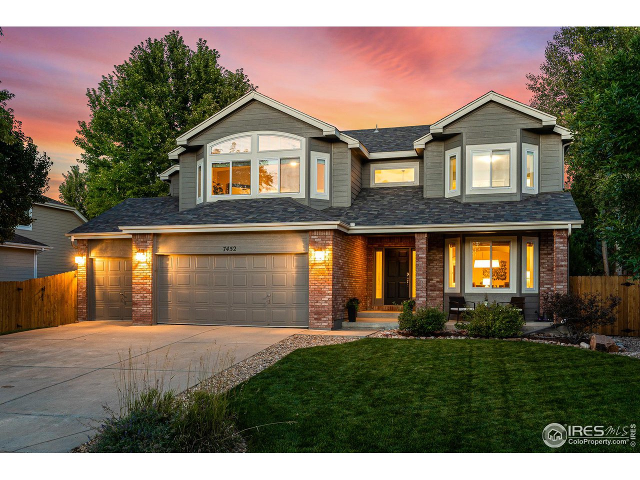 7452 Augusta Drive Boulder, CO 80301 - Photo 2 of 40 a front view of a house with a yard and garage