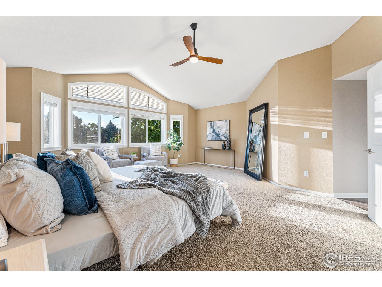 7452 Augusta Drive Boulder, CO 80301 - Photo 21 of 40 a large bedroom with a bed and a large window