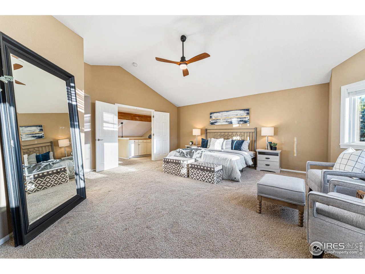 7452 Augusta Drive Boulder, CO 80301 - Photo 24 of 40 a bedroom with furniture and a large window