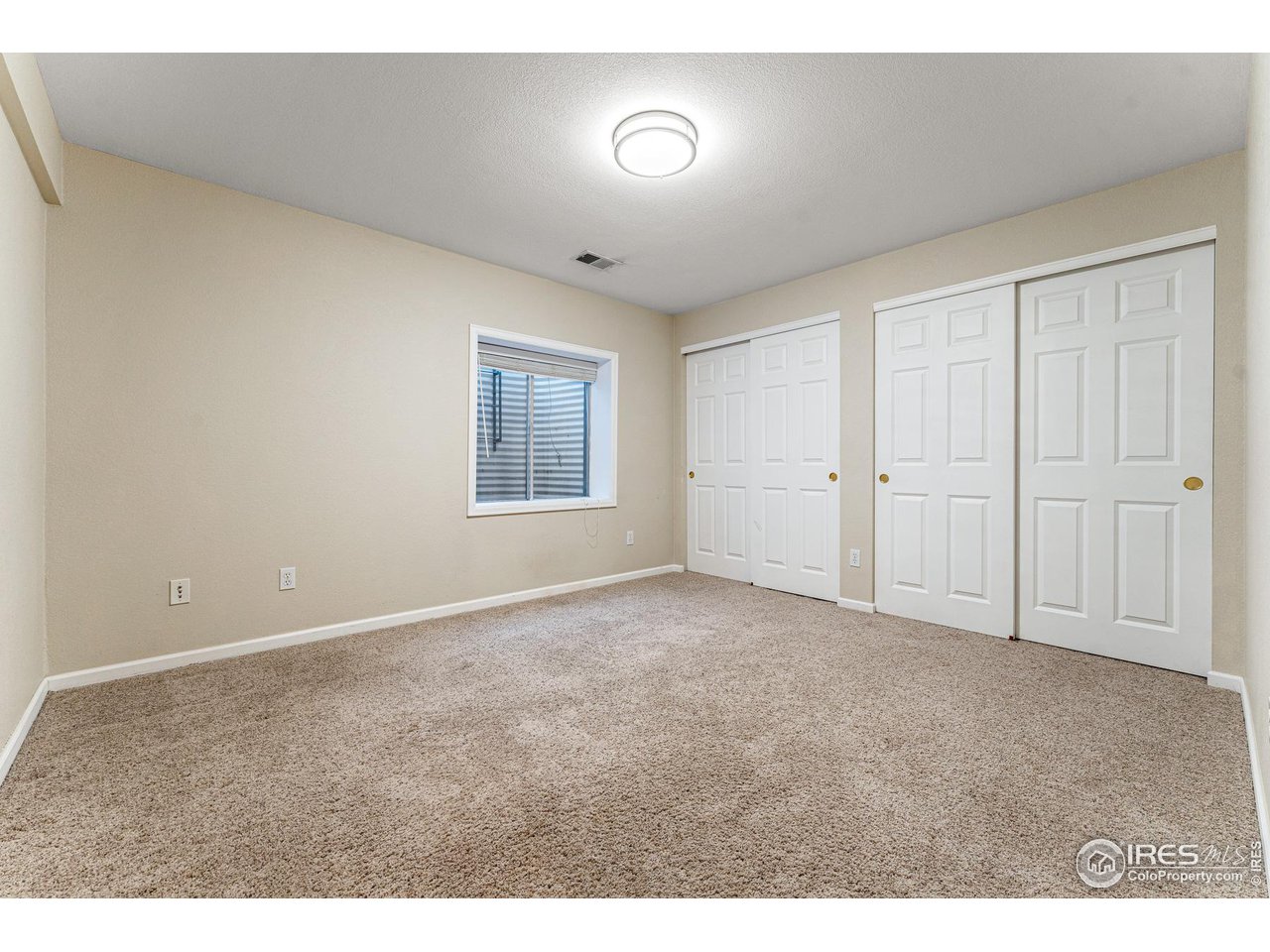 7452 Augusta Drive Boulder, CO 80301 - Photo 31 of 40 an empty room with windows and closet