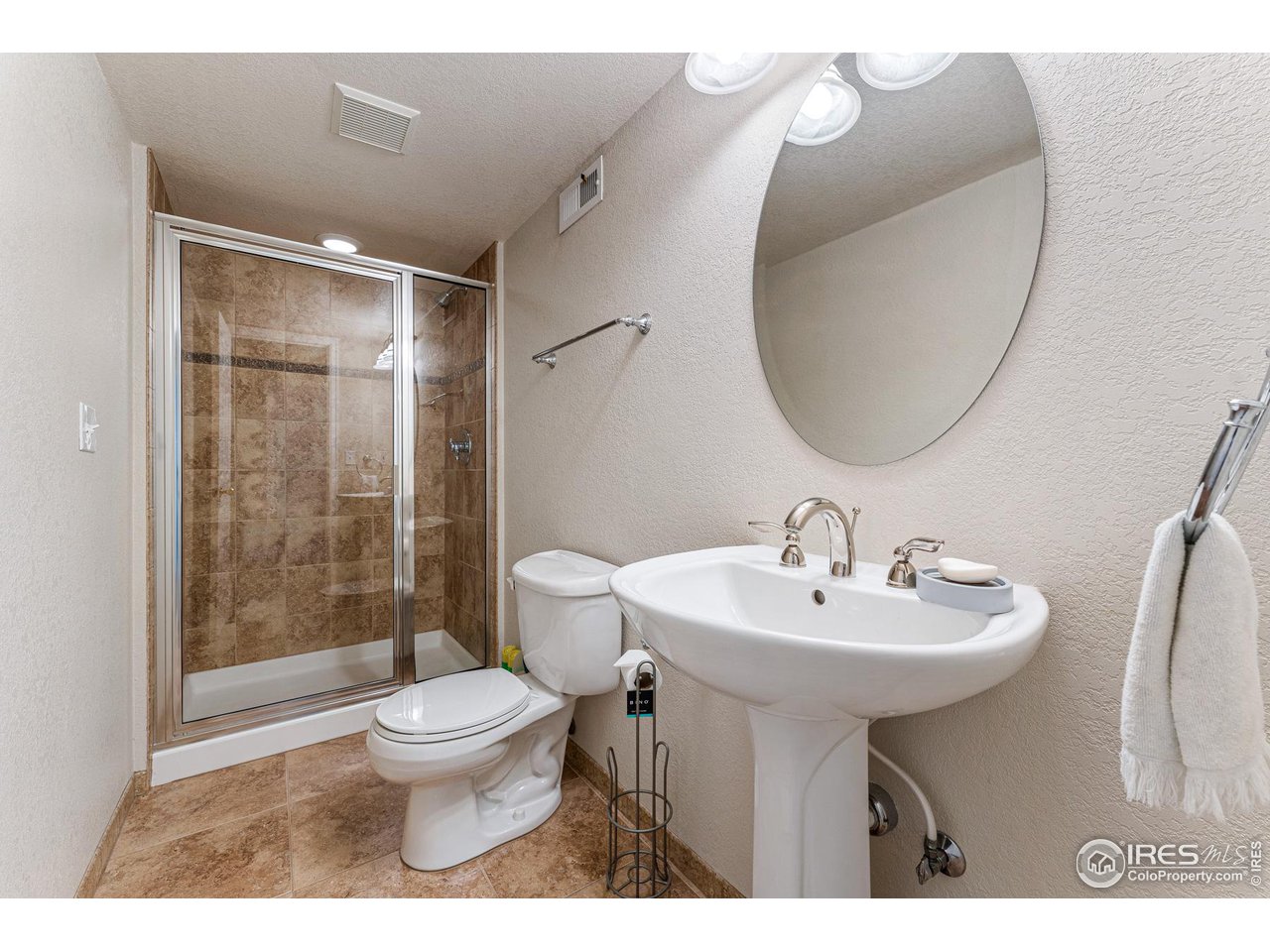 7452 Augusta Drive Boulder, CO 80301 - Photo 32 of 40 a bathroom with a sink toilet and a mirror