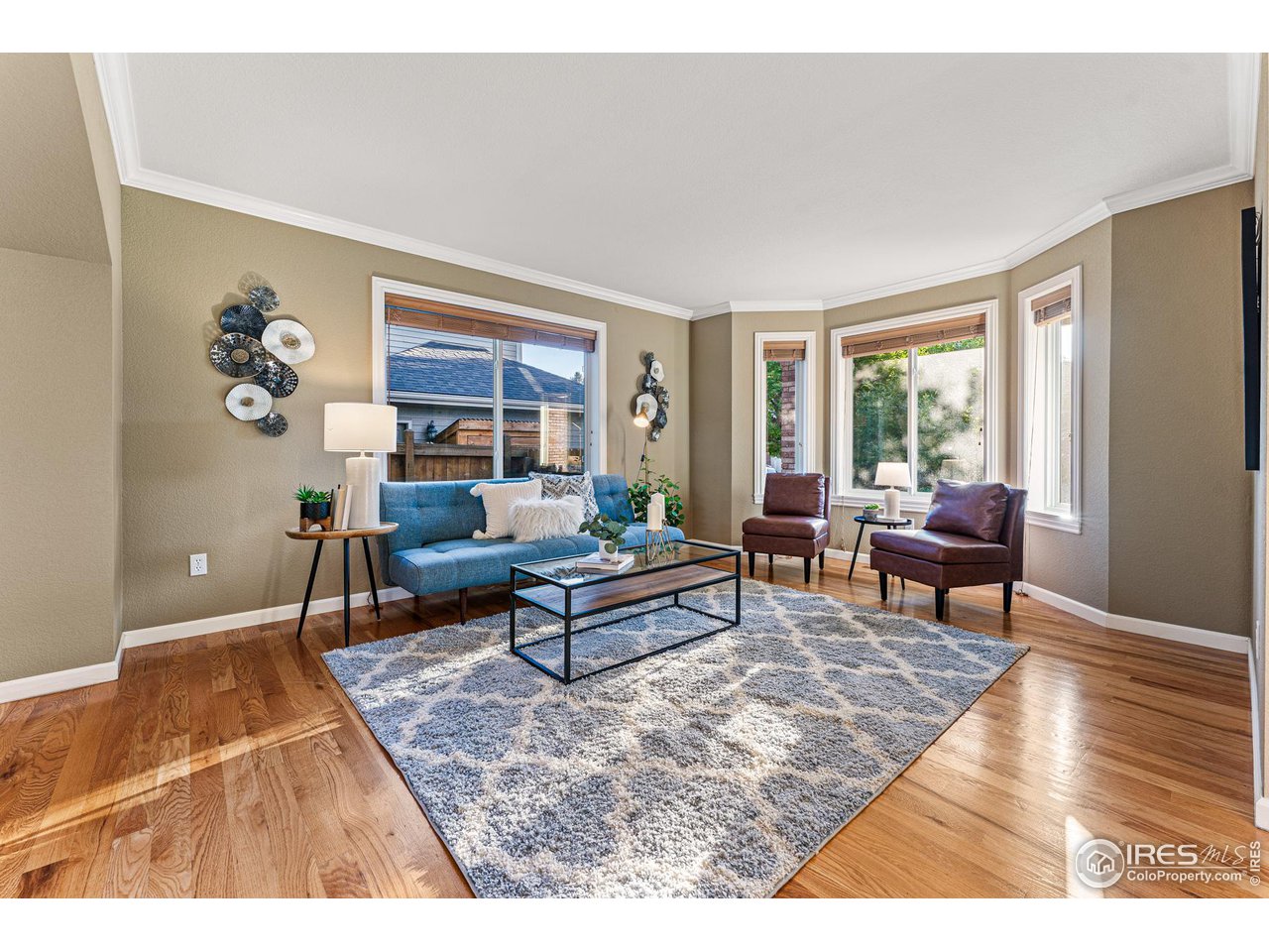 7452 Augusta Drive Boulder, CO 80301 - Photo 5 of 40 a living room with furniture a rug and a window