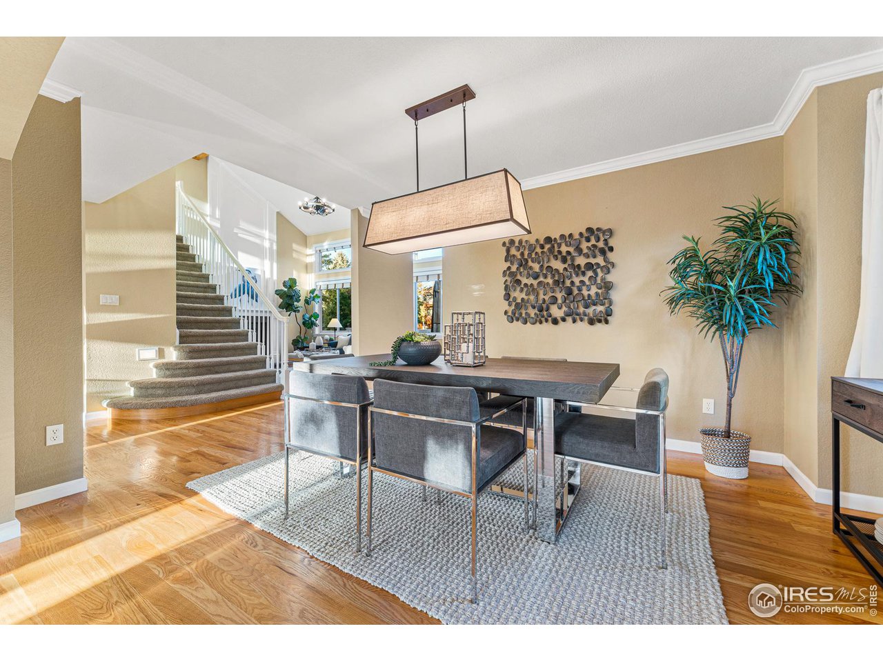 7452 Augusta Drive Boulder, CO 80301 - Photo 7 of 40 a view of a dining room with furniture and wooden floor