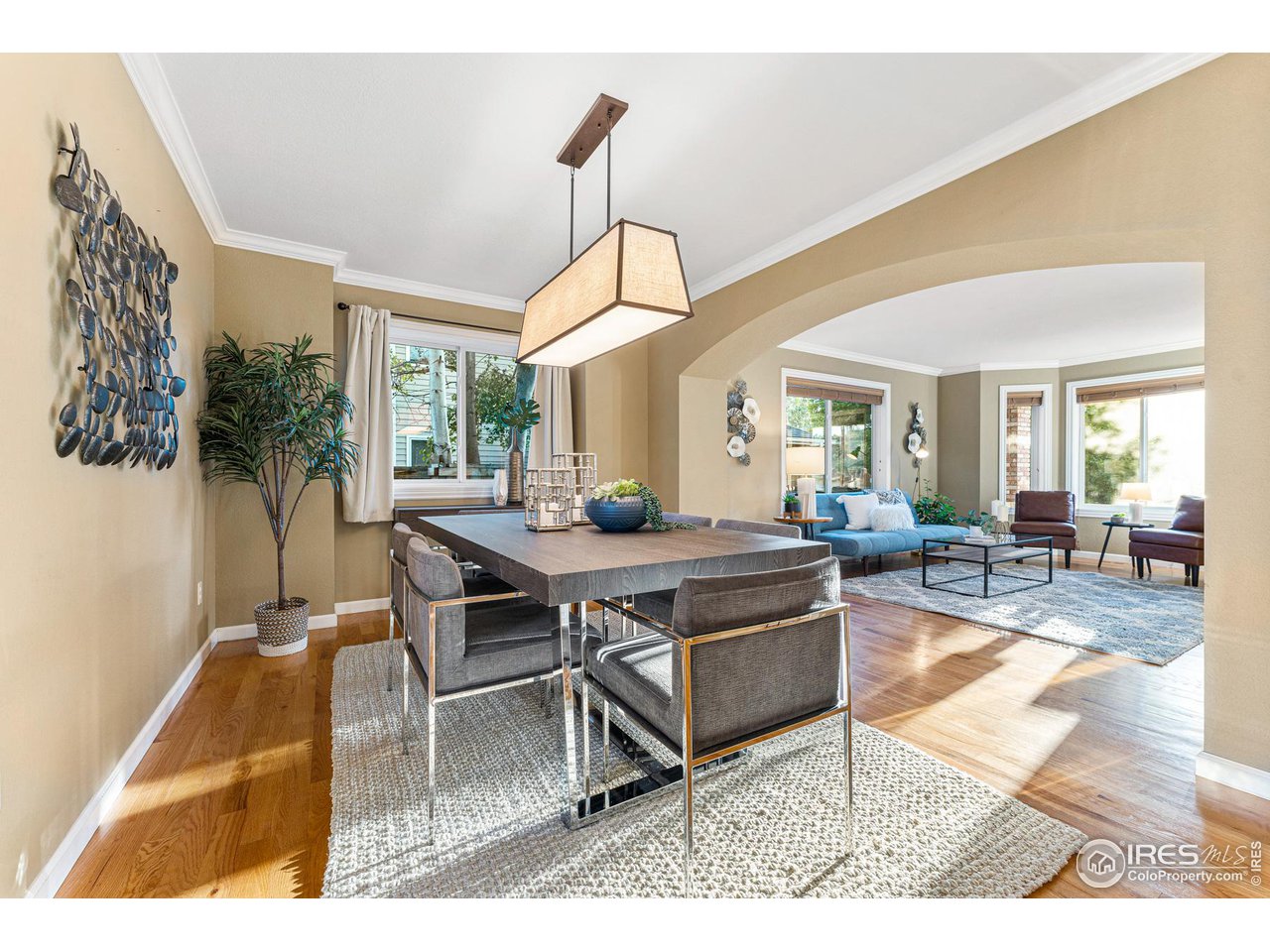7452 Augusta Drive Boulder, CO 80301 - Photo 8 of 40 a living room with a table chairs and a dining table