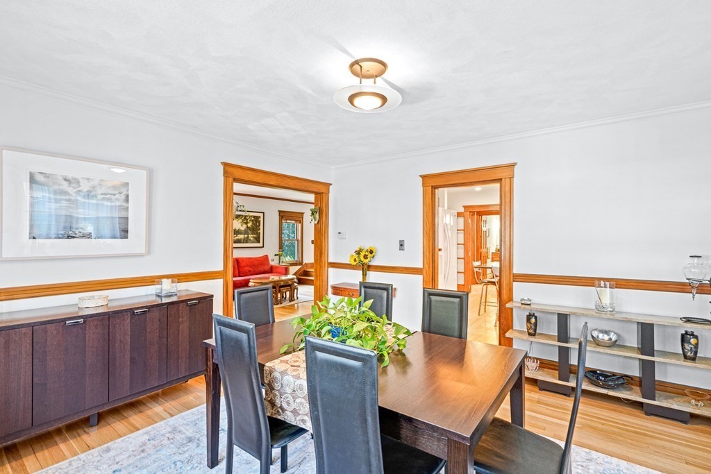 11 Ronald Road Arlington, MA 02474 - Photo 11 of 42 a dining room with furniture a rug and wooden floor