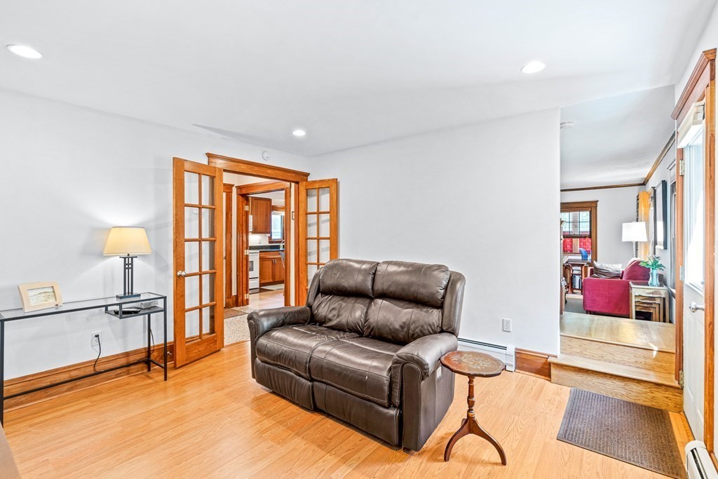 11 Ronald Road Arlington, MA 02474 - Photo 20 of 42 a living room with furniture and a flat screen tv