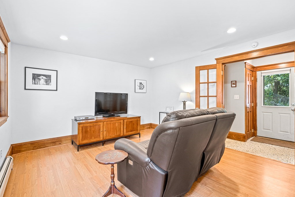 11 Ronald Road Arlington, MA 02474 - Photo 21 of 42 a living room with furniture and a flat screen tv