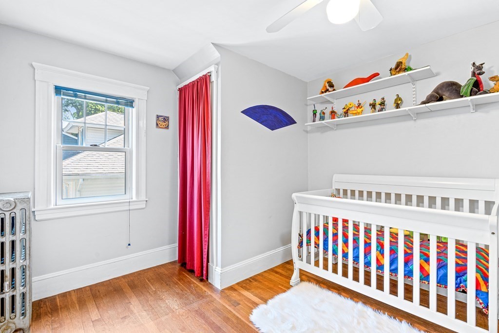 11 Ronald Road Arlington, MA 02474 - Photo 27 of 42 a bedroom with furniture and a window