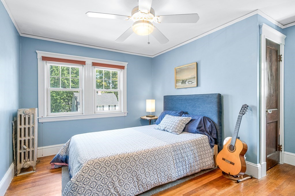 11 Ronald Road Arlington, MA 02474 - Photo 29 of 42 a bedroom with a bed and wooden floor