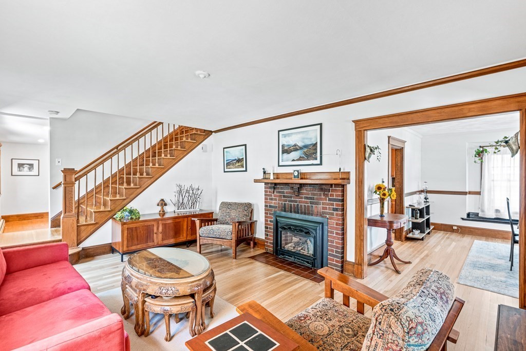 11 Ronald Road Arlington, MA 02474 - Photo 31 of 42 a living room with furniture a rug and a fireplace