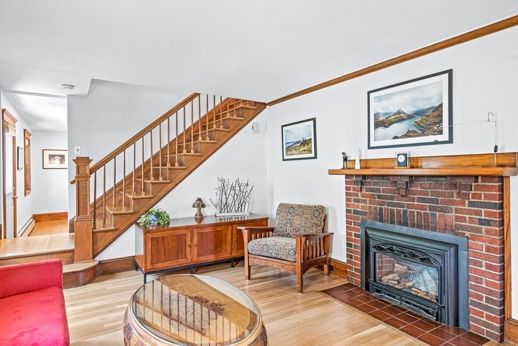 11 Ronald Road Arlington, MA 02474 - Photo 32 of 42 a living room with furniture and a fireplace