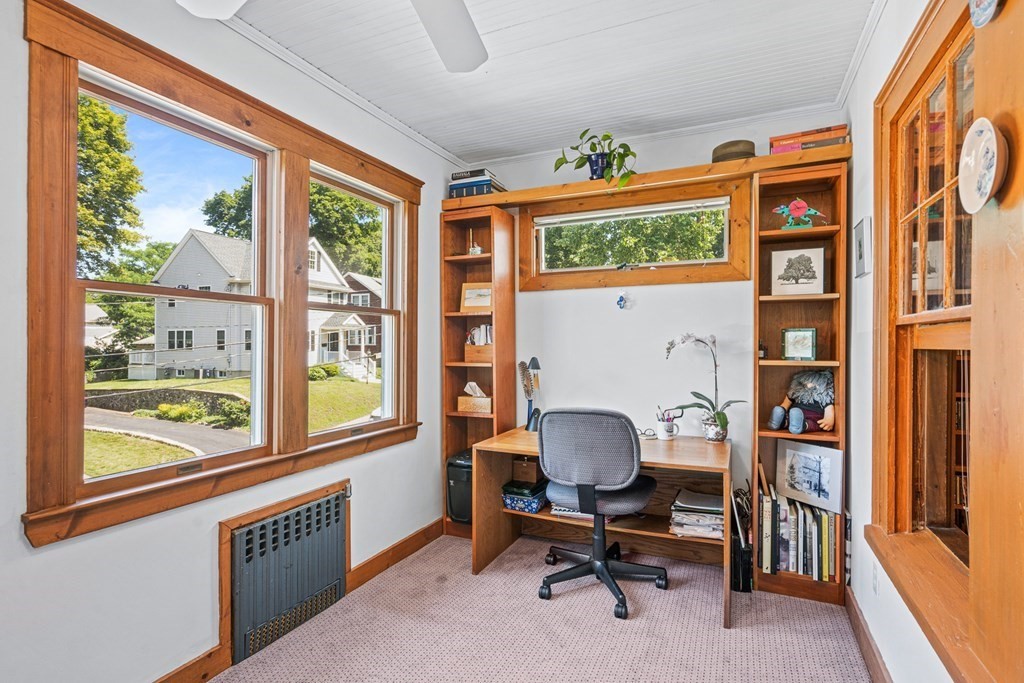 11 Ronald Road Arlington, MA 02474 - Photo 5 of 42 a view of a workspace with furniture and a window