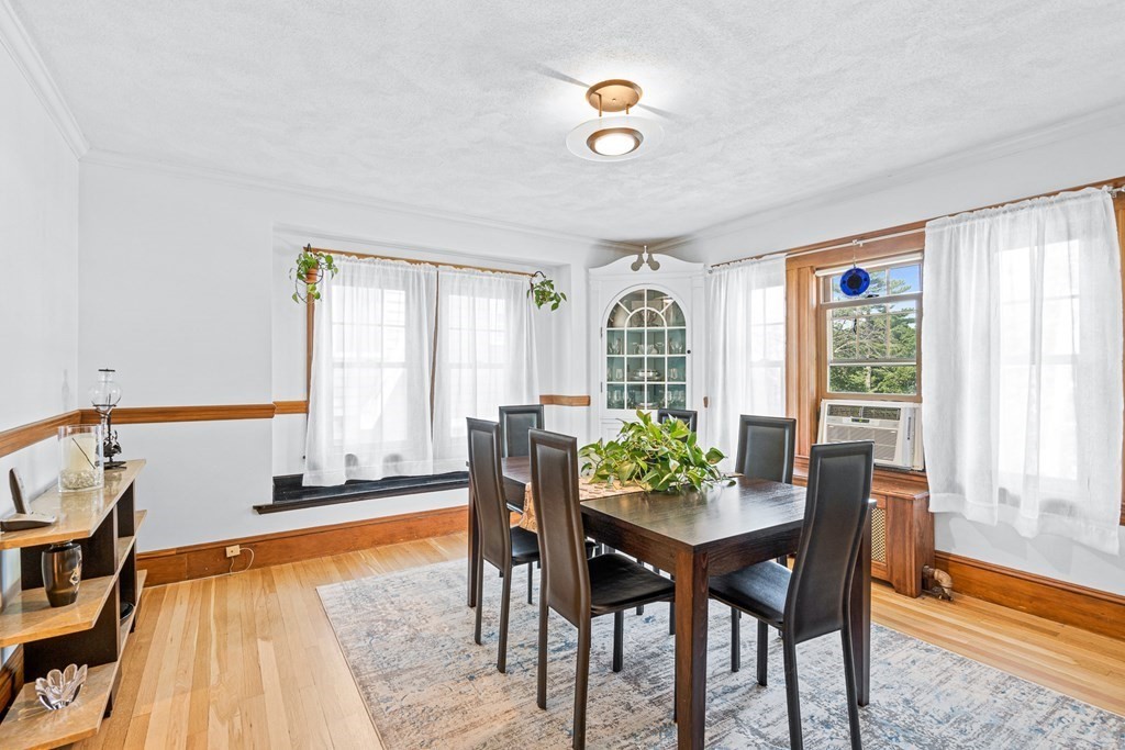11 Ronald Road Arlington, MA 02474 - Photo 9 of 42 a view of a dining room with furniture and a window