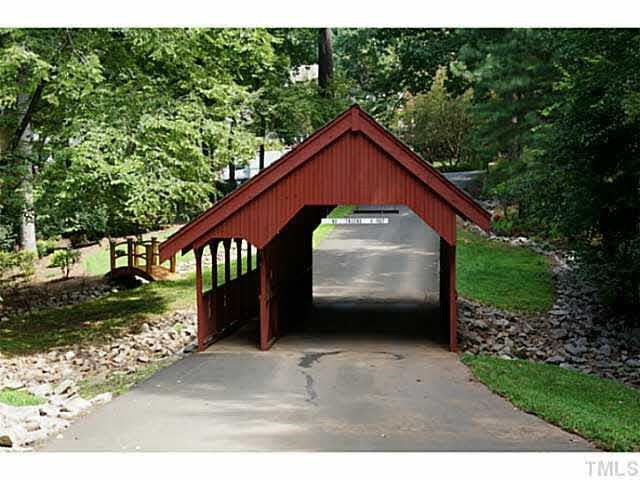 5516 North Hawthorne Park Raleigh, NC 27613 - Photo 23 of 25 Covered bridge takes you through the private community.
