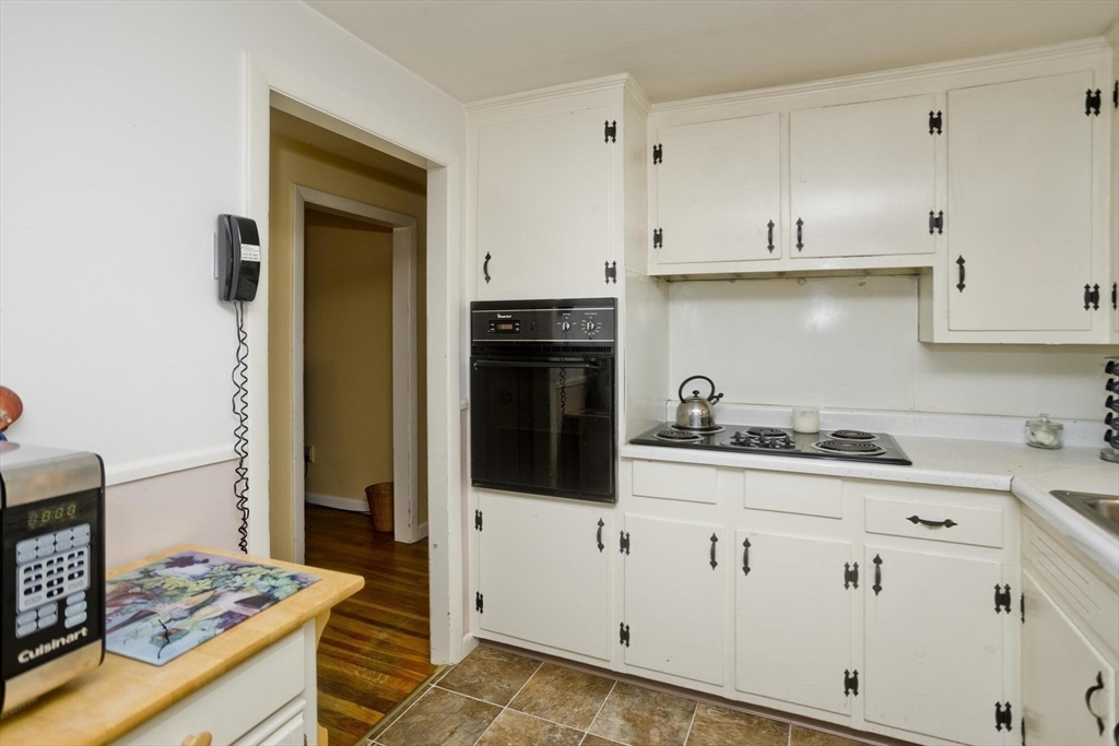 6 North Brook Road Springfield, MA 01119 - Photo 12 of 42 a kitchen with stainless steel appliances granite countertop a sink and cabinets