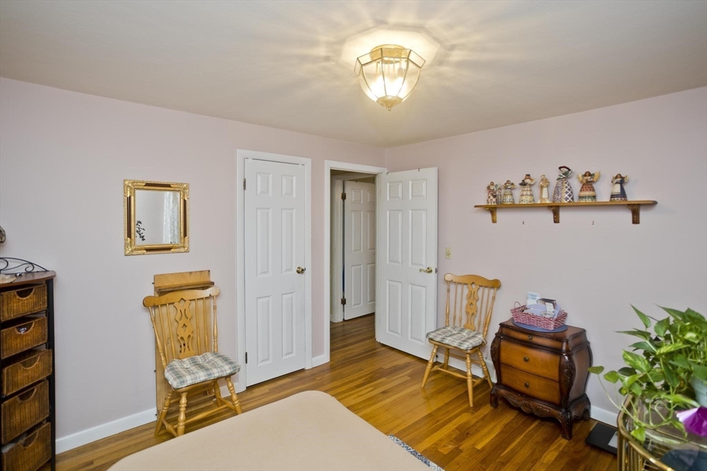 6 North Brook Road Springfield, MA 01119 - Photo 24 of 42 a bedroom with a bed and wooden floor