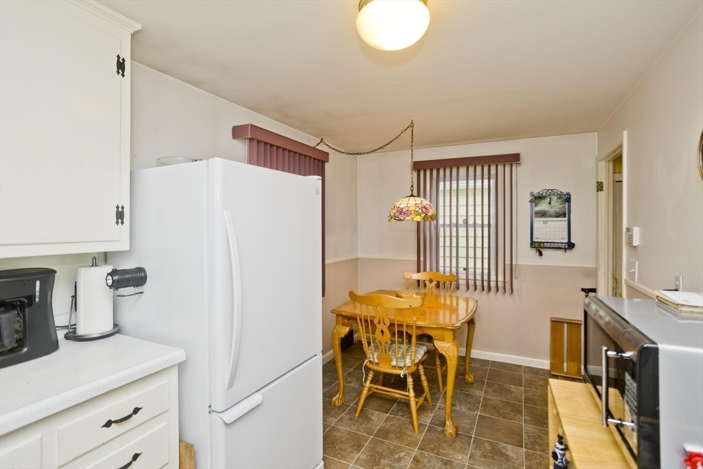 6 North Brook Road Springfield, MA 01119 - Photo 8 of 42 a kitchen with a refrigerator and table