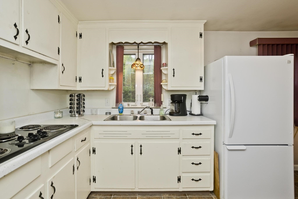 6 North Brook Road Springfield, MA 01119 - Photo 10 of 42 a kitchen with stainless steel appliances a refrigerator stove and sink