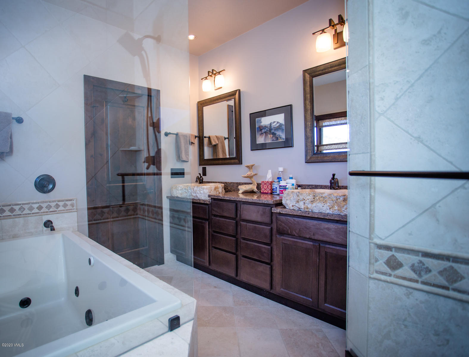 850 Main Street, Unit A Minturn, CO 81645 - Photo 14 of 34 a bathroom with a tub sink and mirror