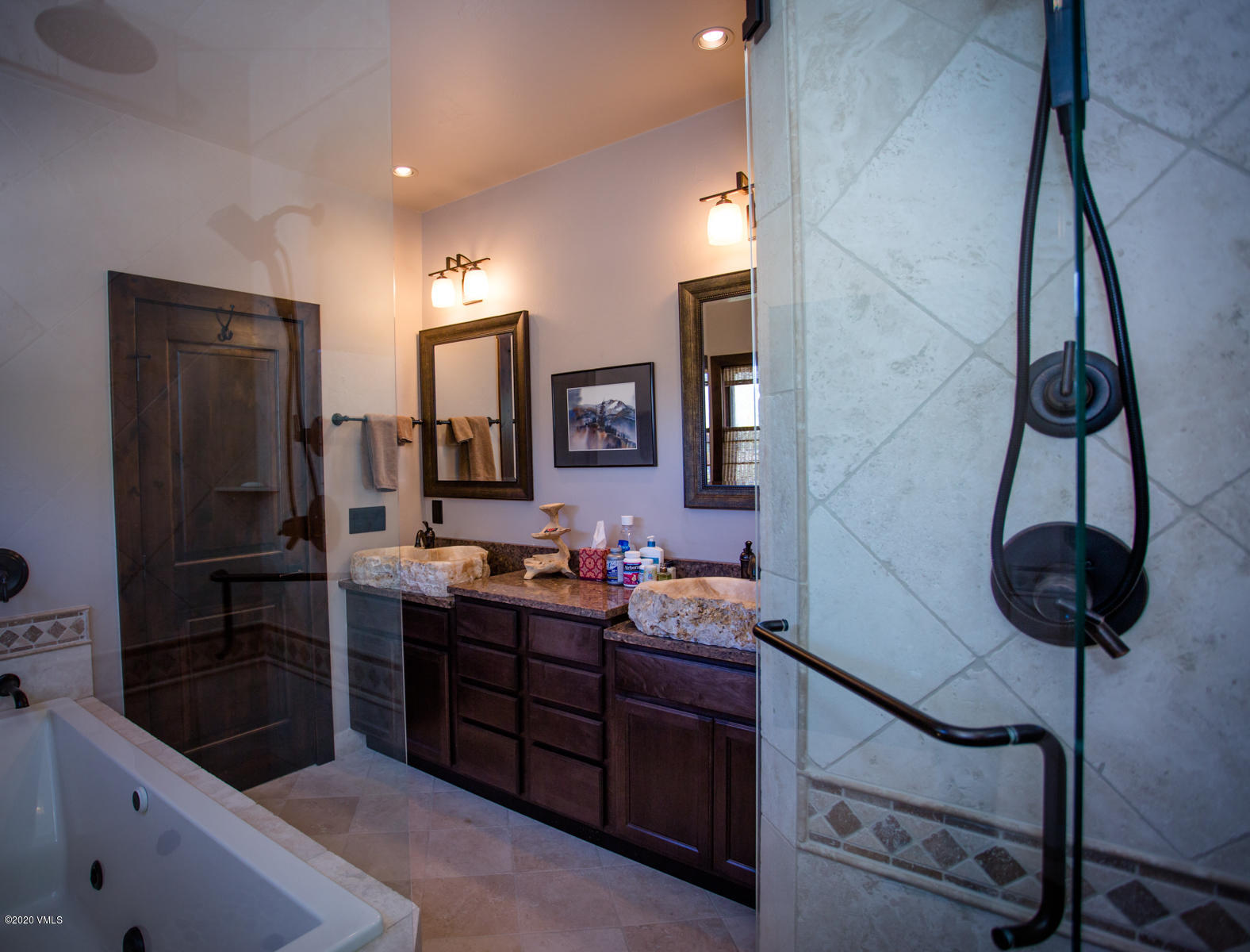 850 Main Street, Unit A Minturn, CO 81645 - Photo 15 of 34 a spacious bathroom with a granite countertop sink a mirror and shower