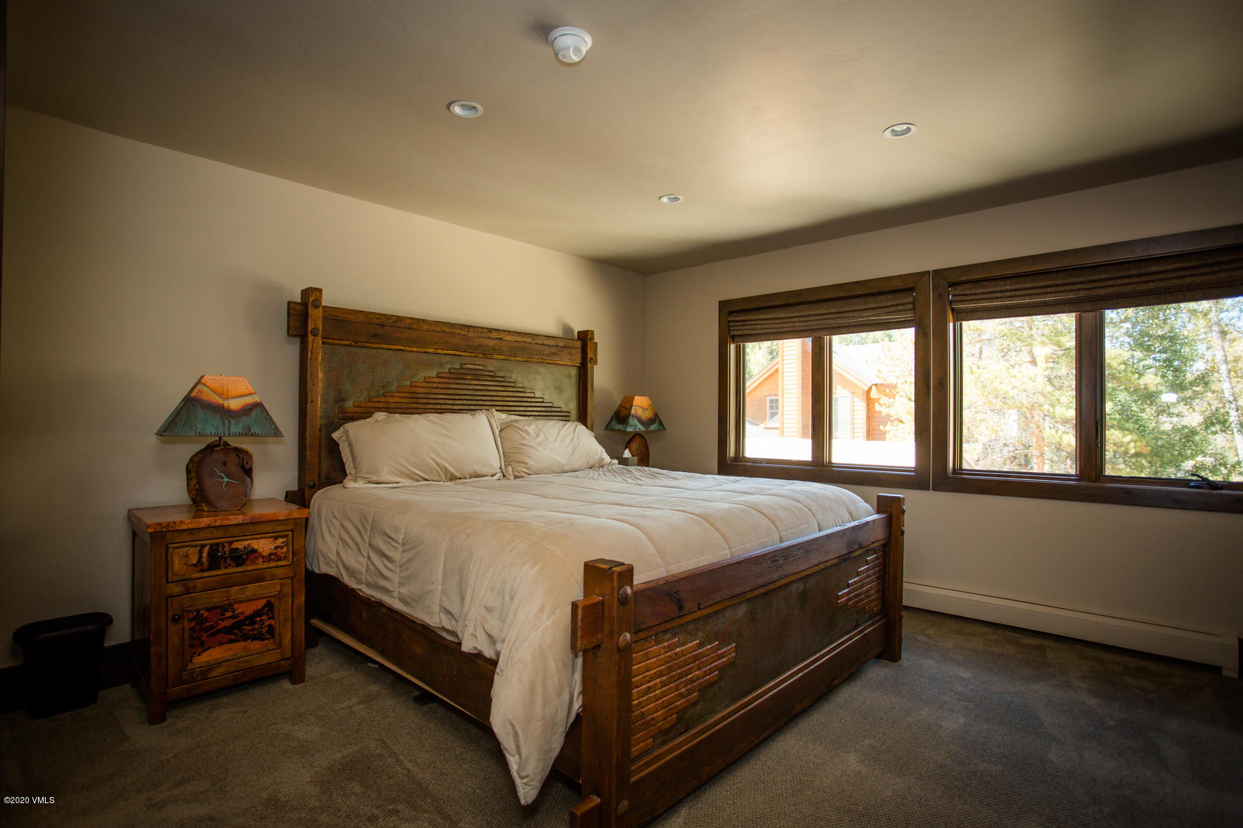 850 Main Street, Unit A Minturn, CO 81645 - Photo 19 of 34 a bed sitting in a bedroom next to a window