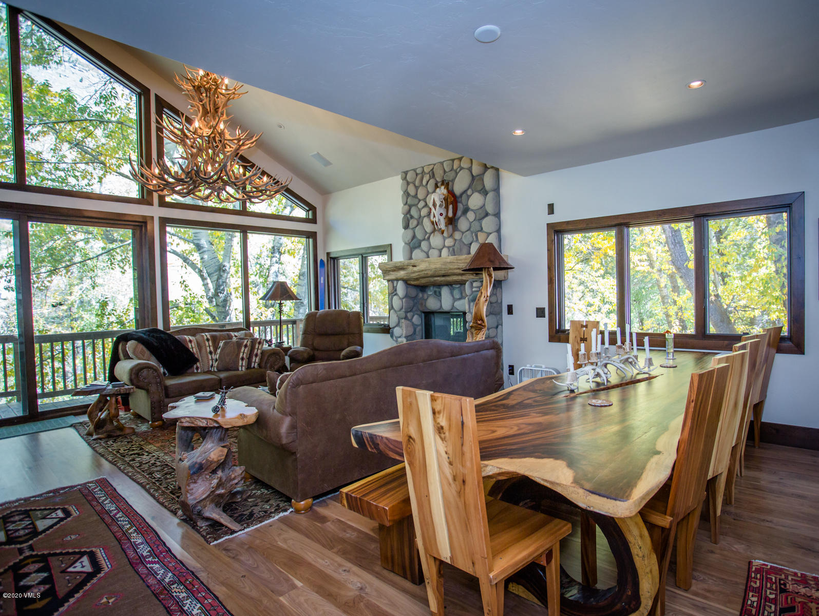 850 Main Street, Unit A Minturn, CO 81645 - Photo 2 of 34 a dining room with furniture a large window and a rug