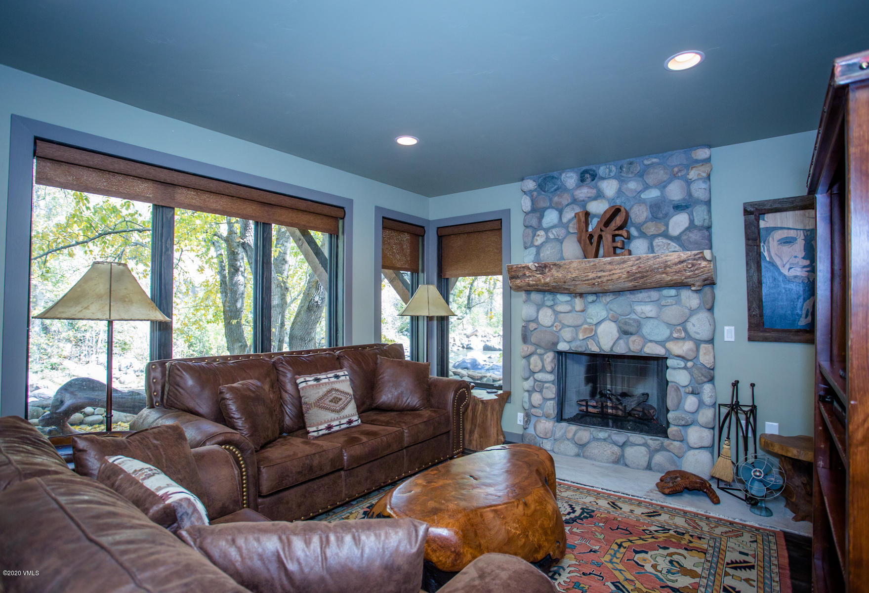 850 Main Street, Unit A Minturn, CO 81645 - Photo 22 of 34 a living room with furniture and a fireplace
