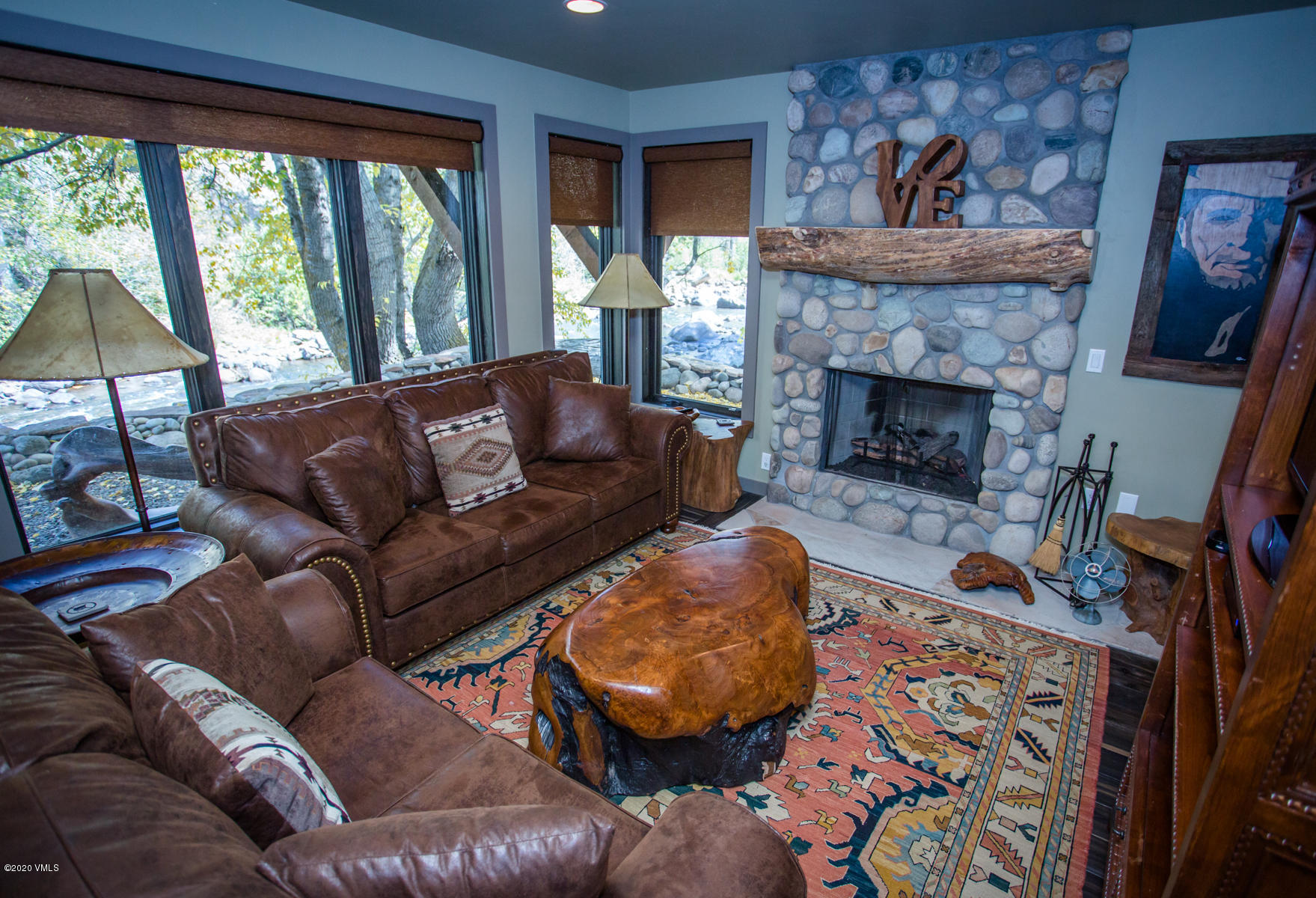850 Main Street, Unit A Minturn, CO 81645 - Photo 23 of 34 a living room with furniture and a fireplace