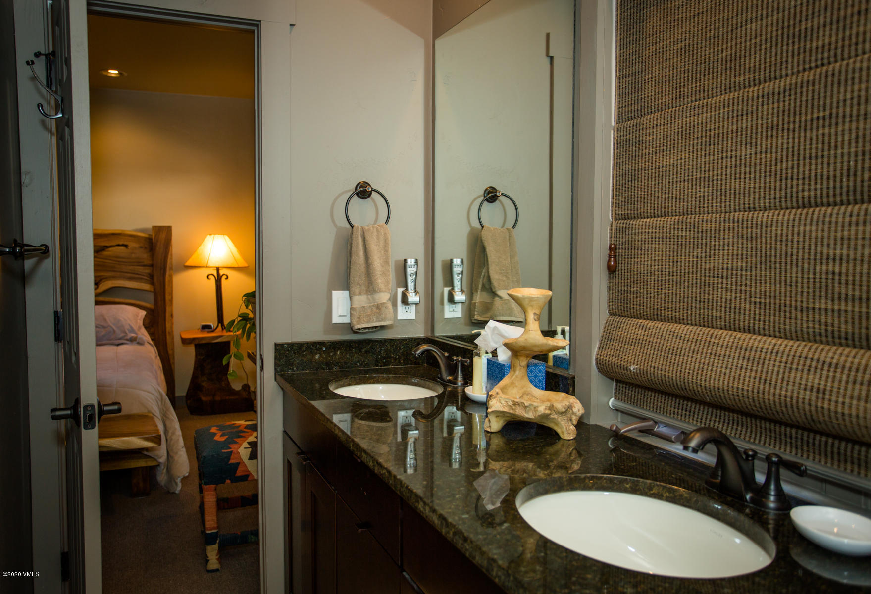 850 Main Street, Unit A Minturn, CO 81645 - Photo 28 of 34 a bathroom with a granite countertop sink and a mirror