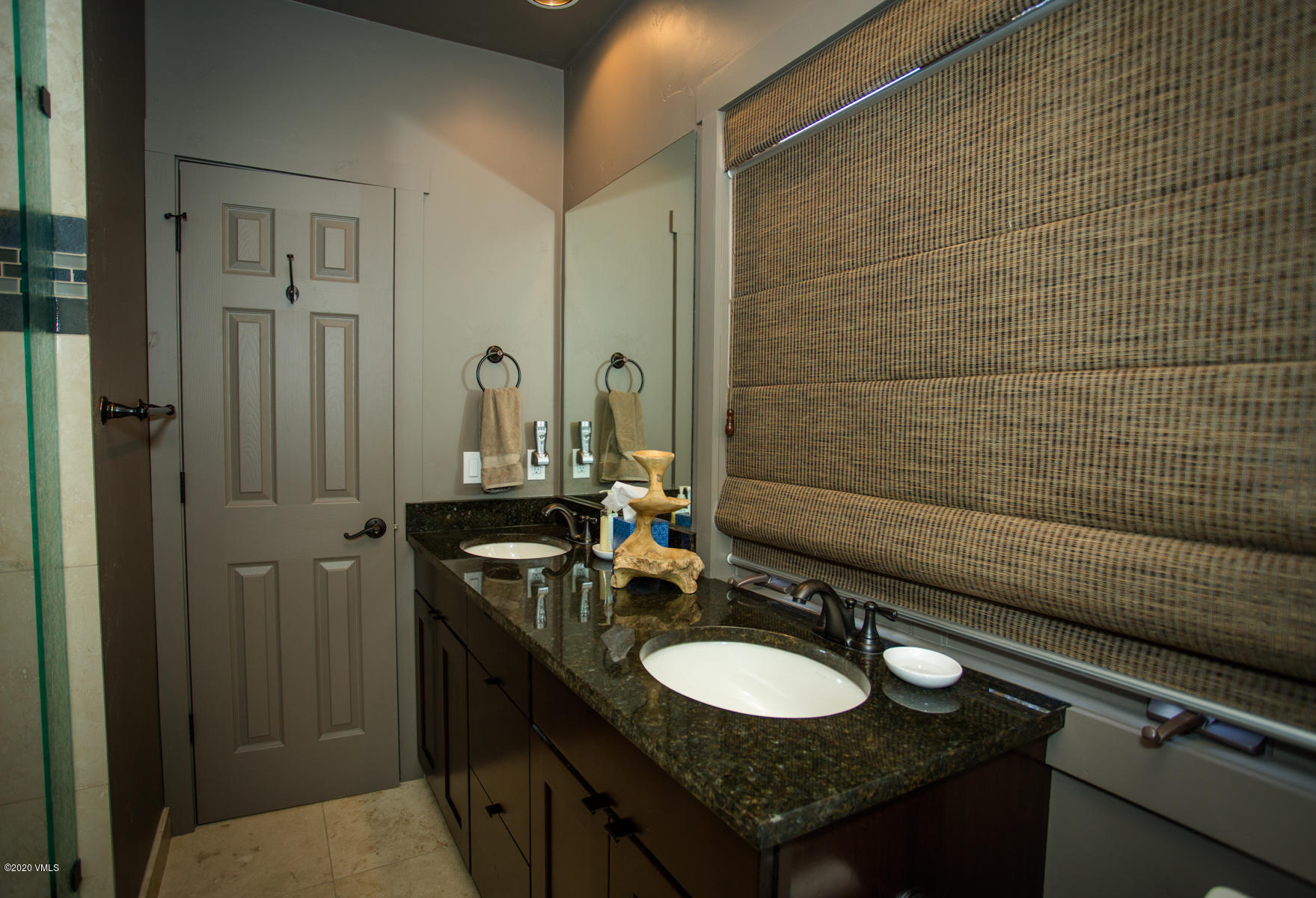850 Main Street, Unit A Minturn, CO 81645 - Photo 29 of 34 a bathroom with a granite countertop sink and a mirror