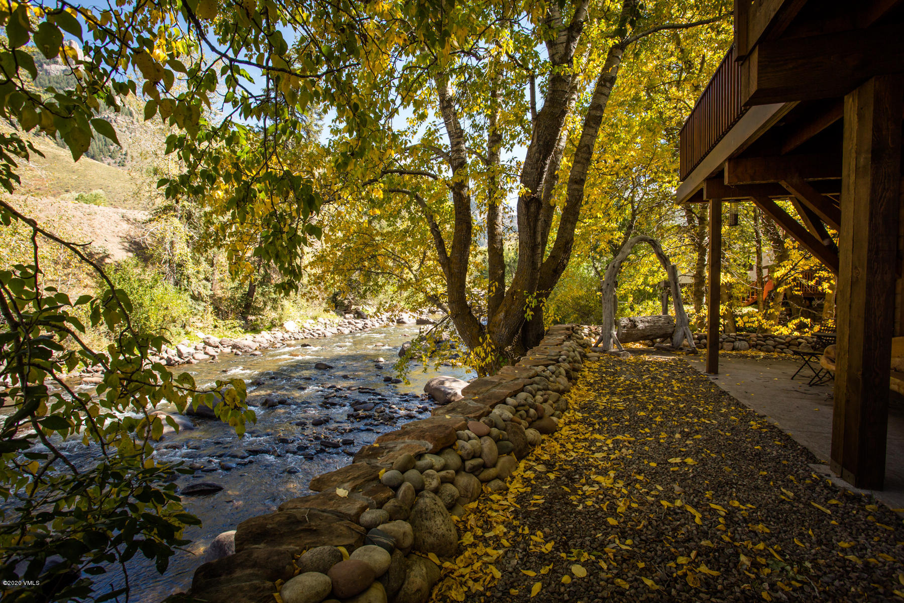 850 Main Street, Unit A Minturn, CO 81645 - Photo 30 of 34 a view of a yard with plants and large trees