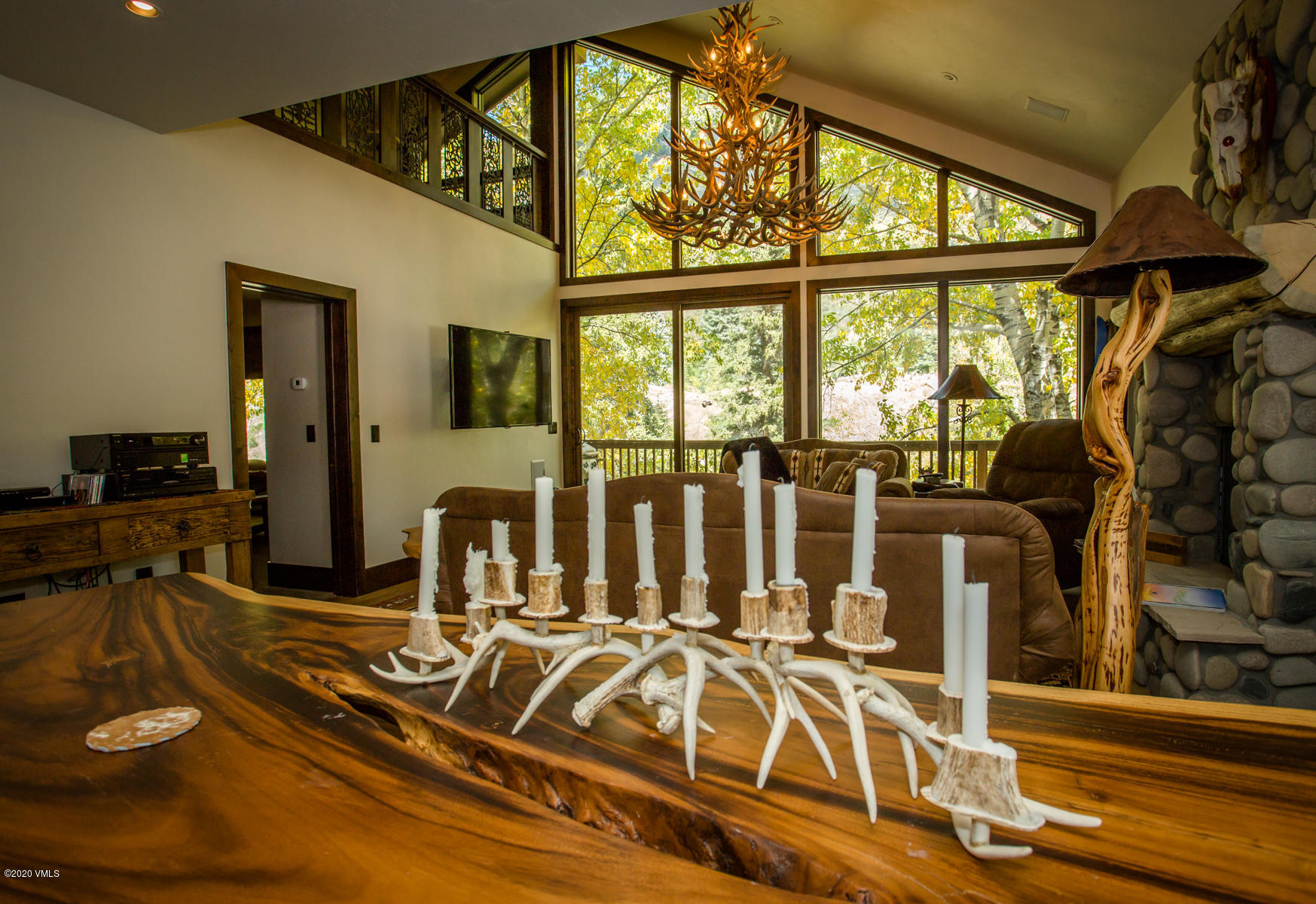 850 Main Street, Unit A Minturn, CO 81645 - Photo 3 of 34 a view of a livingroom with wooden floor and furniture