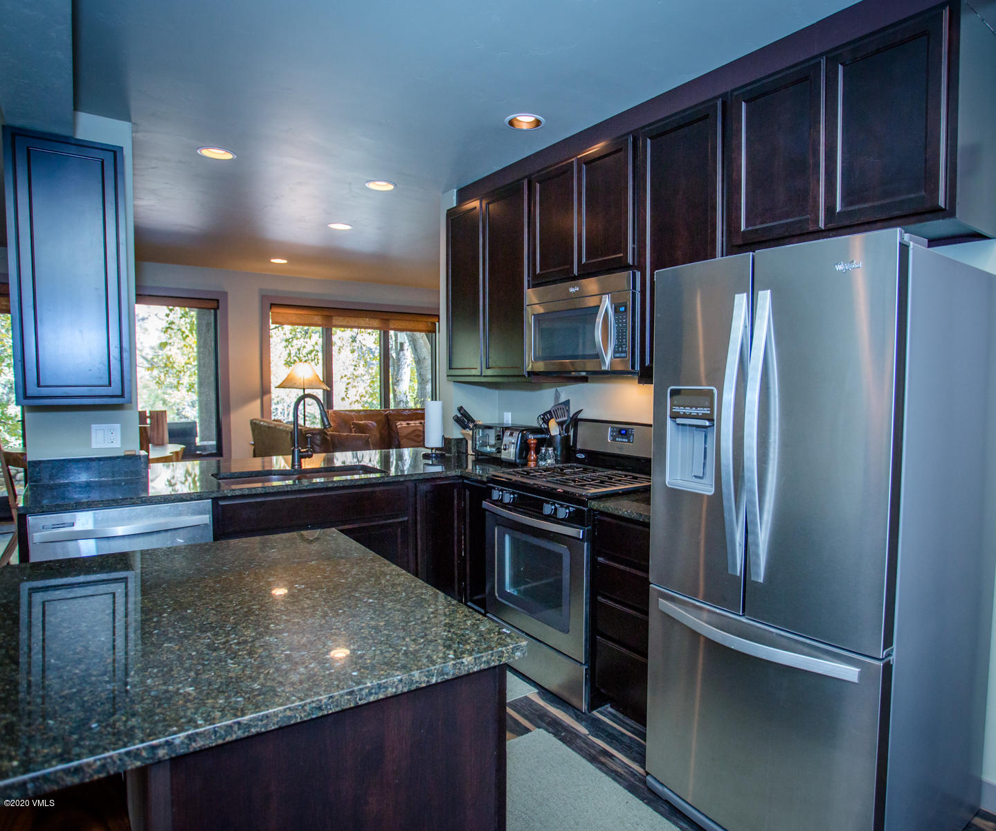 850 Main Street, Unit A Minturn, CO 81645 - Photo 6 of 34 a kitchen with stainless steel appliances granite countertop a refrigerator and a stove top oven