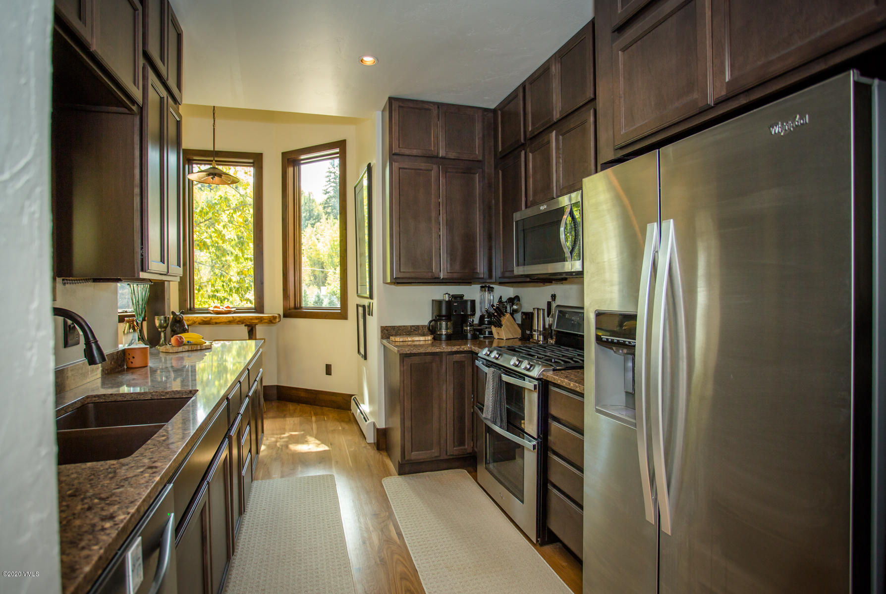 850 Main Street, Unit A Minturn, CO 81645 - Photo 7 of 34 a kitchen with a refrigerator and a sink