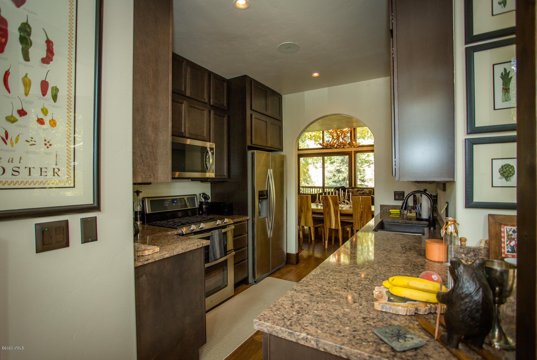 850 Main Street, Unit A Minturn, CO 81645 - Photo 10 of 34 a kitchen with stainless steel appliances granite countertop a stove a sink and a refrigerator