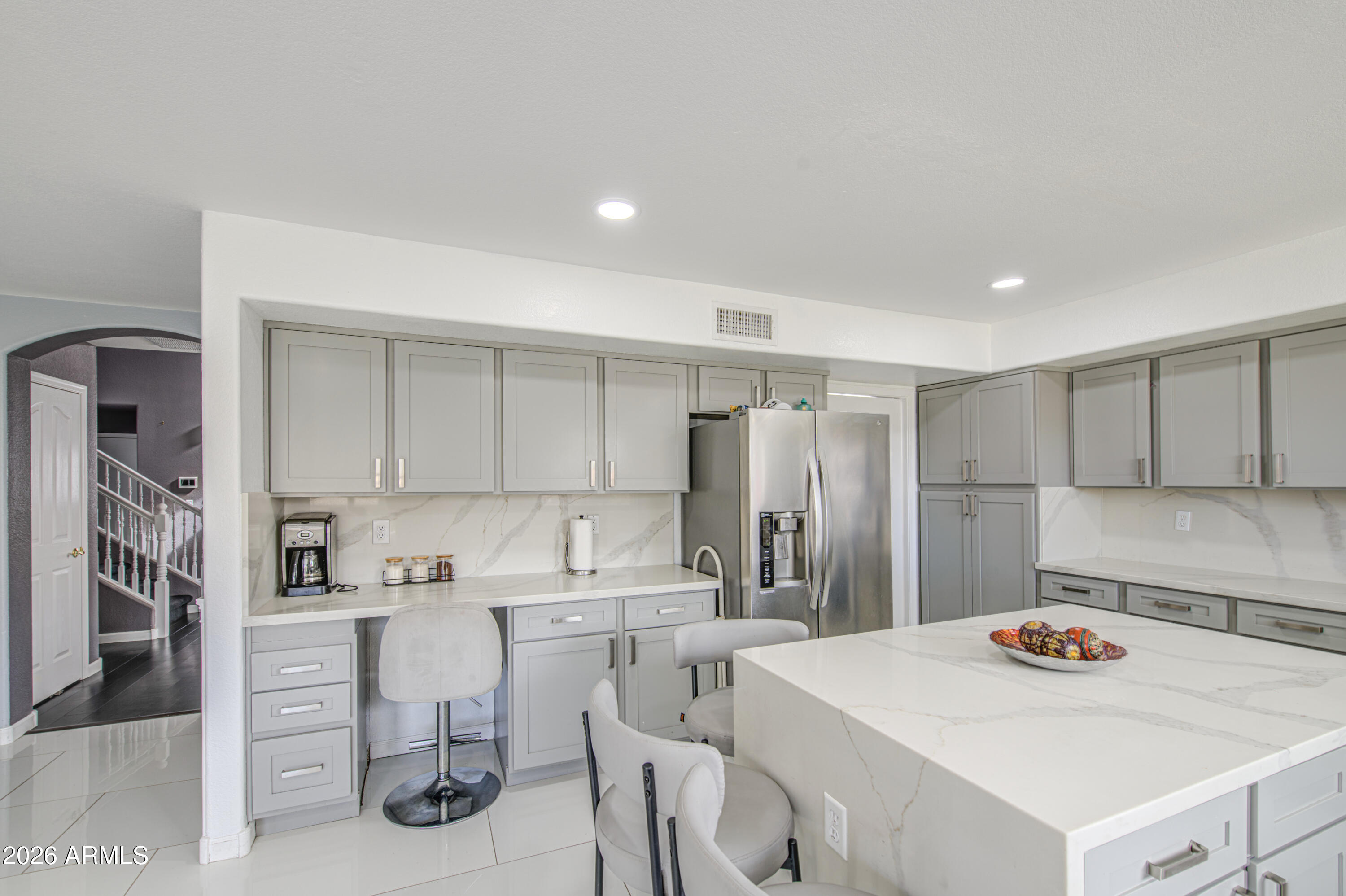 12403 West Monte Vista Road Avondale, AZ 85392 - Photo 23 of 63 a kitchen that has a sink and cabinets
